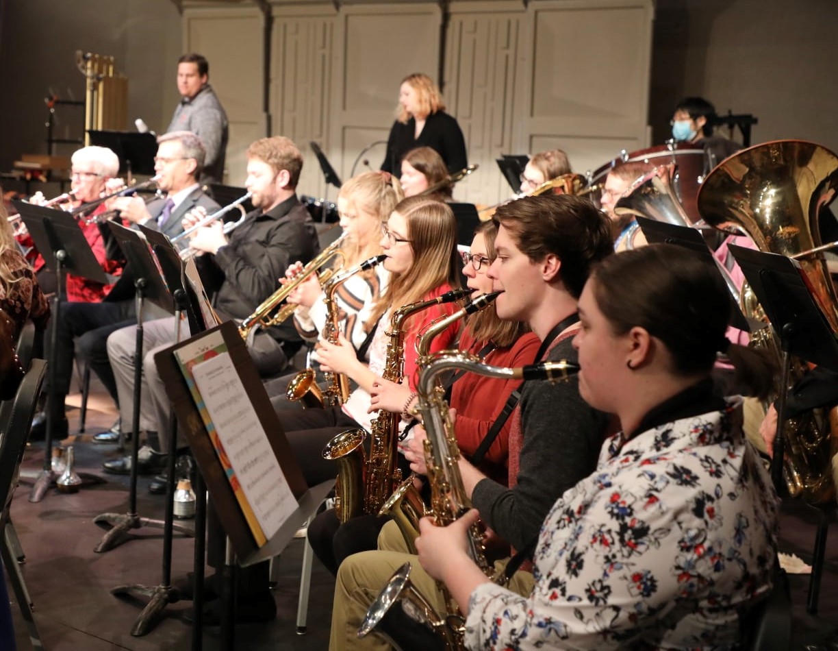 saxophone section performing with the concert band
