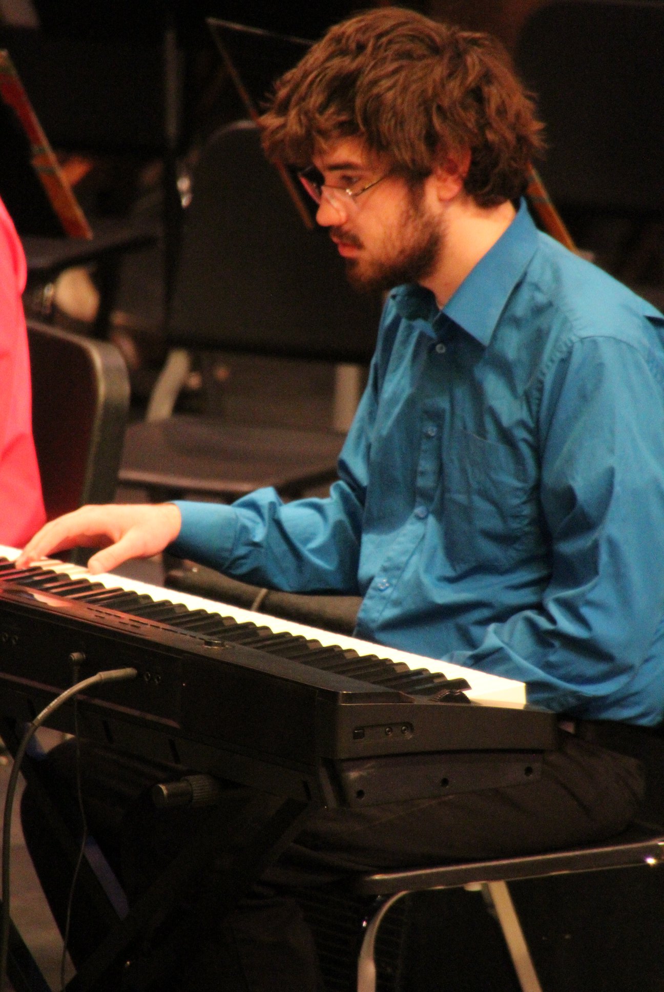 student playing keyboard with the Symphonic Chamber Winds