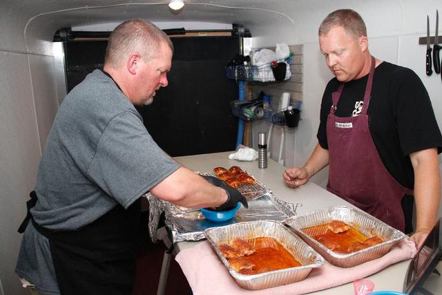 Sons of Butchers team prepares to turn in their chicken during the 2014 competition
