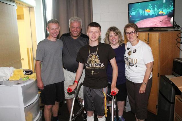 From left: Zach, Paul, Jacob and Monica Zyla and President Connie J. Gores