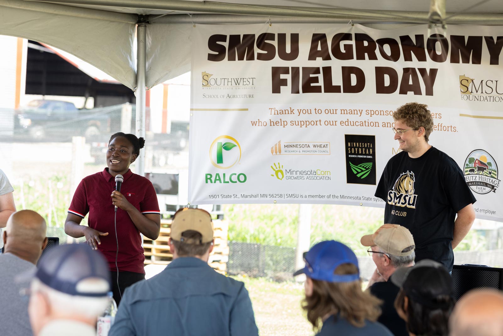 Another student Speaking into a microphone