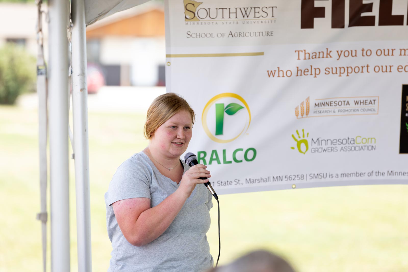 Another student Speaking into a microphone