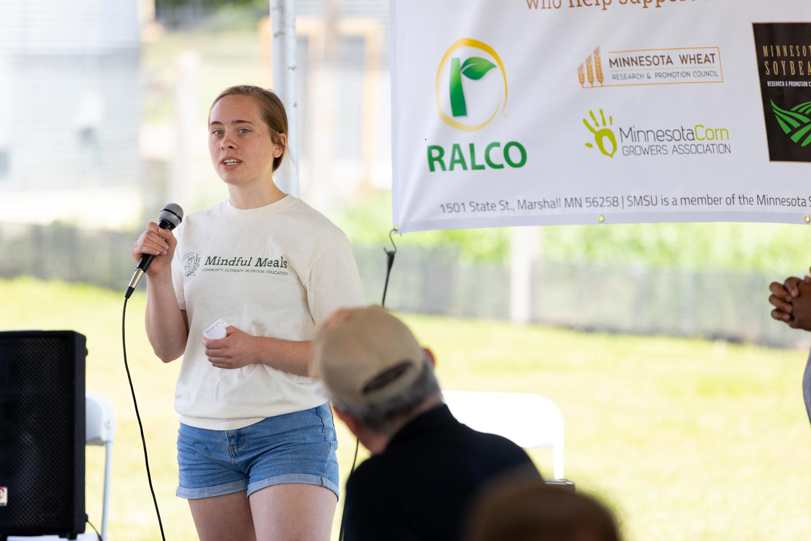 Mindful Meals representative speaking into a microphone