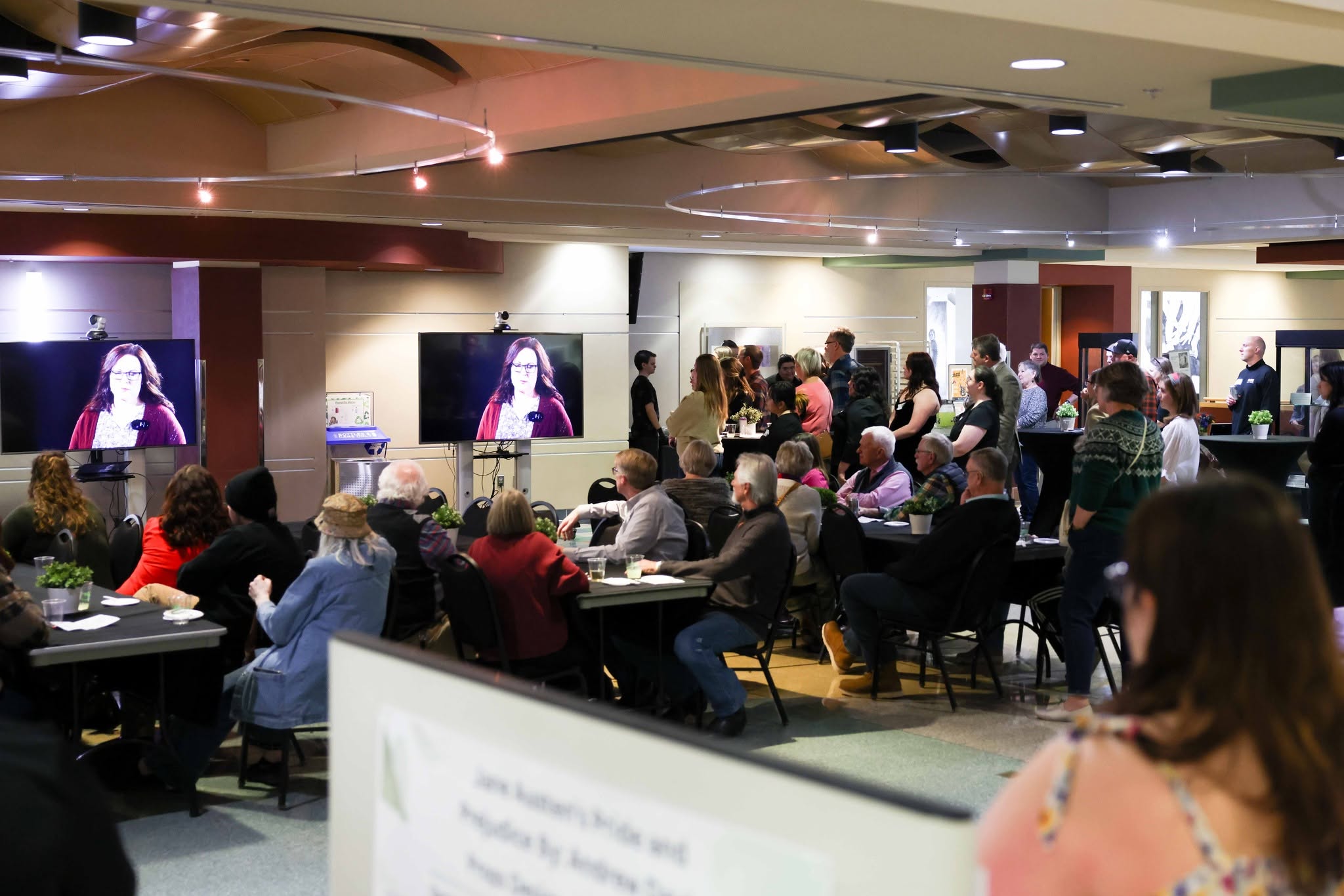 Fine Arts Roundup attendees watching a video presentation