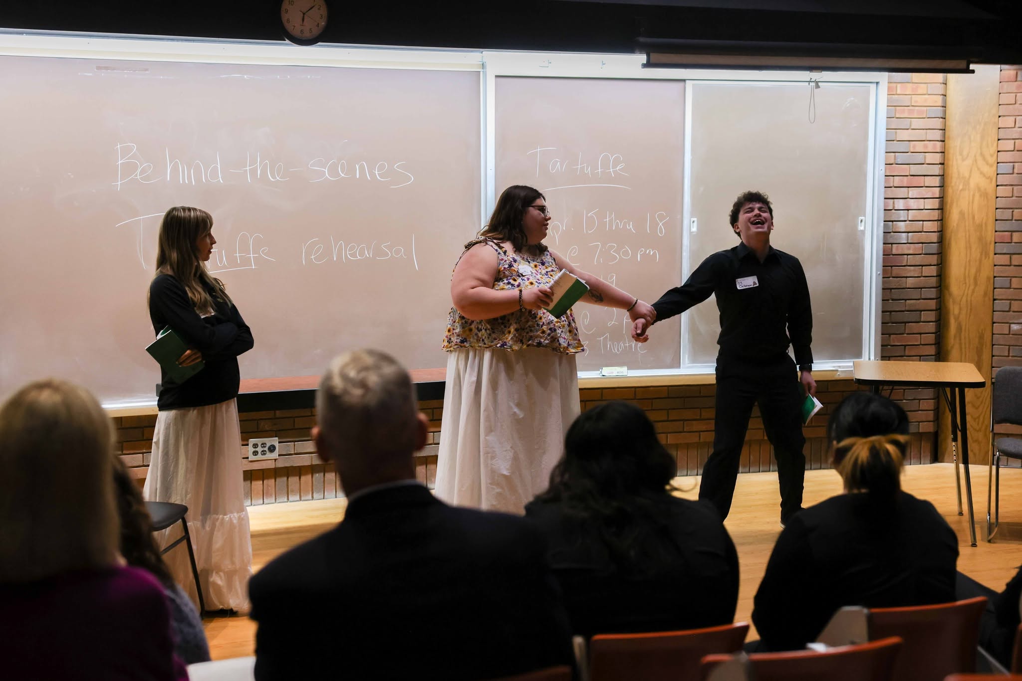 3 Theatre students acting out a scene from an upcoming Theatre show