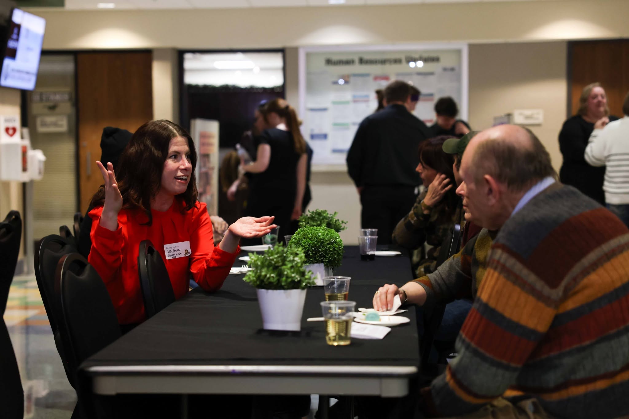 Fine Arts Roundup attendees sitting at a table having a conversation