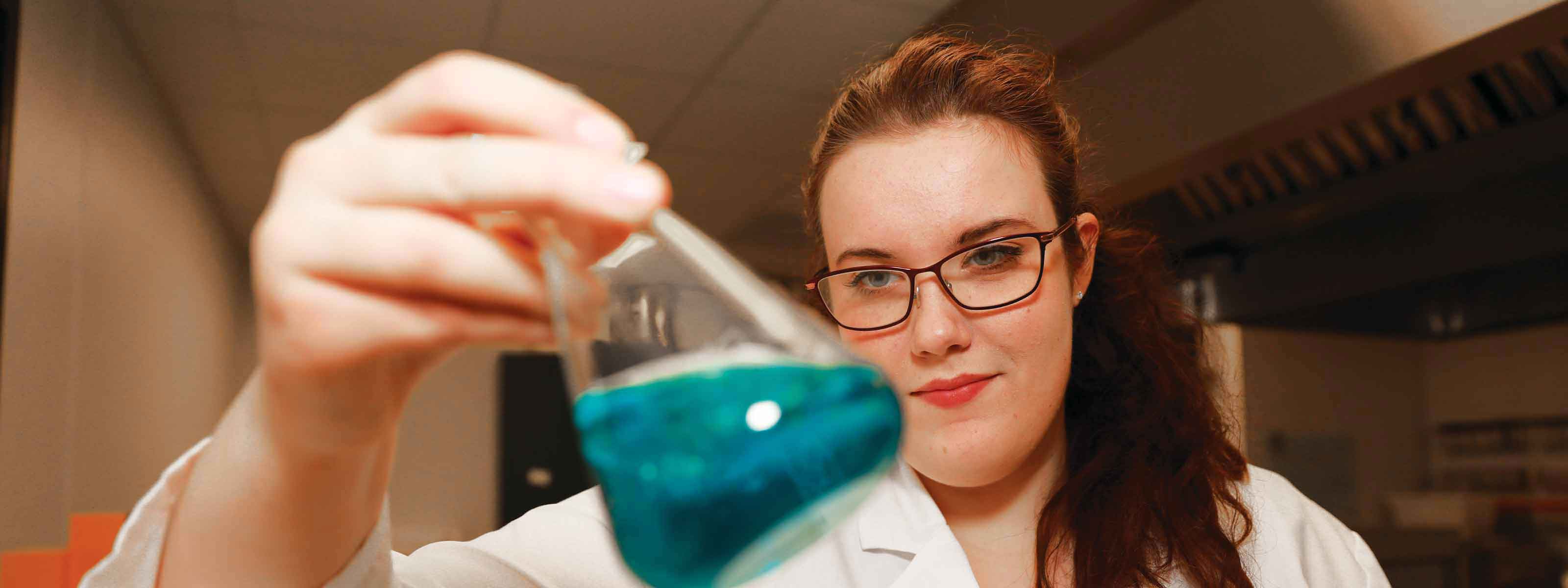 Culinology student mixing ingredients