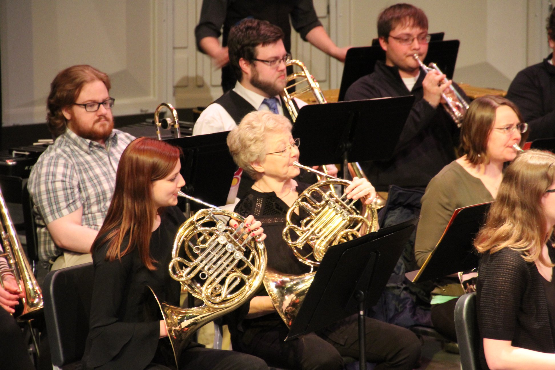 picture of several brass players performing with the concert band