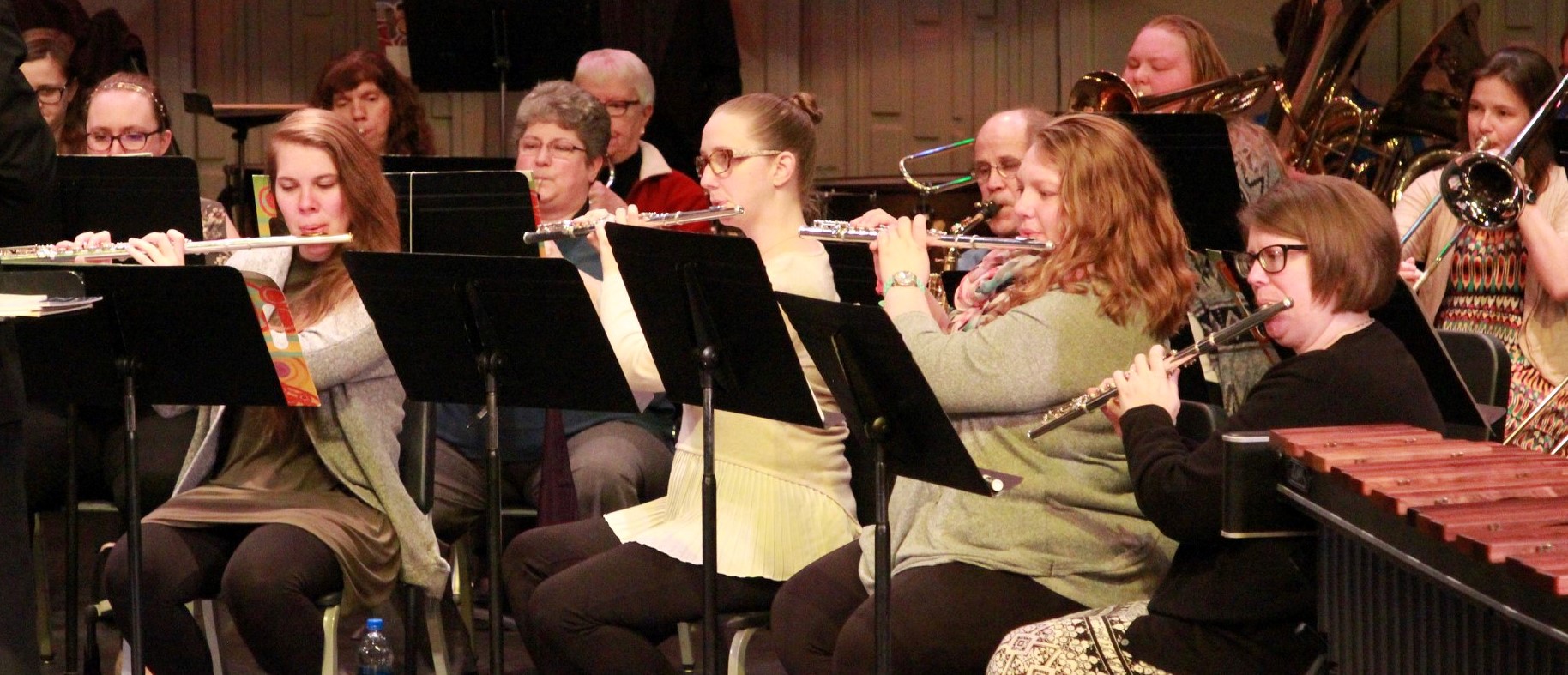 picture of the flute section performing with the Concert Band