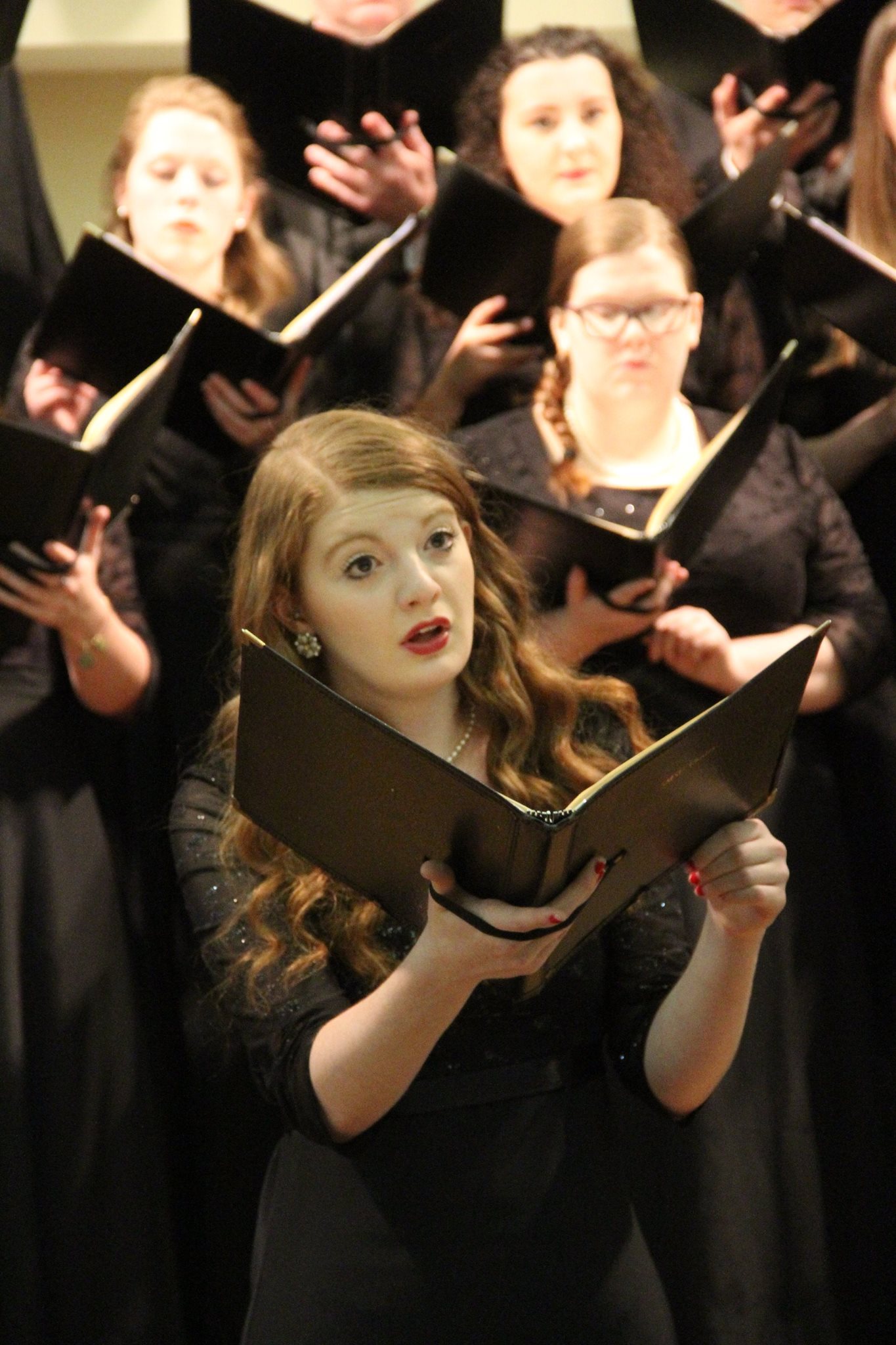 SMSU Music student singing with the SMSU Chorale