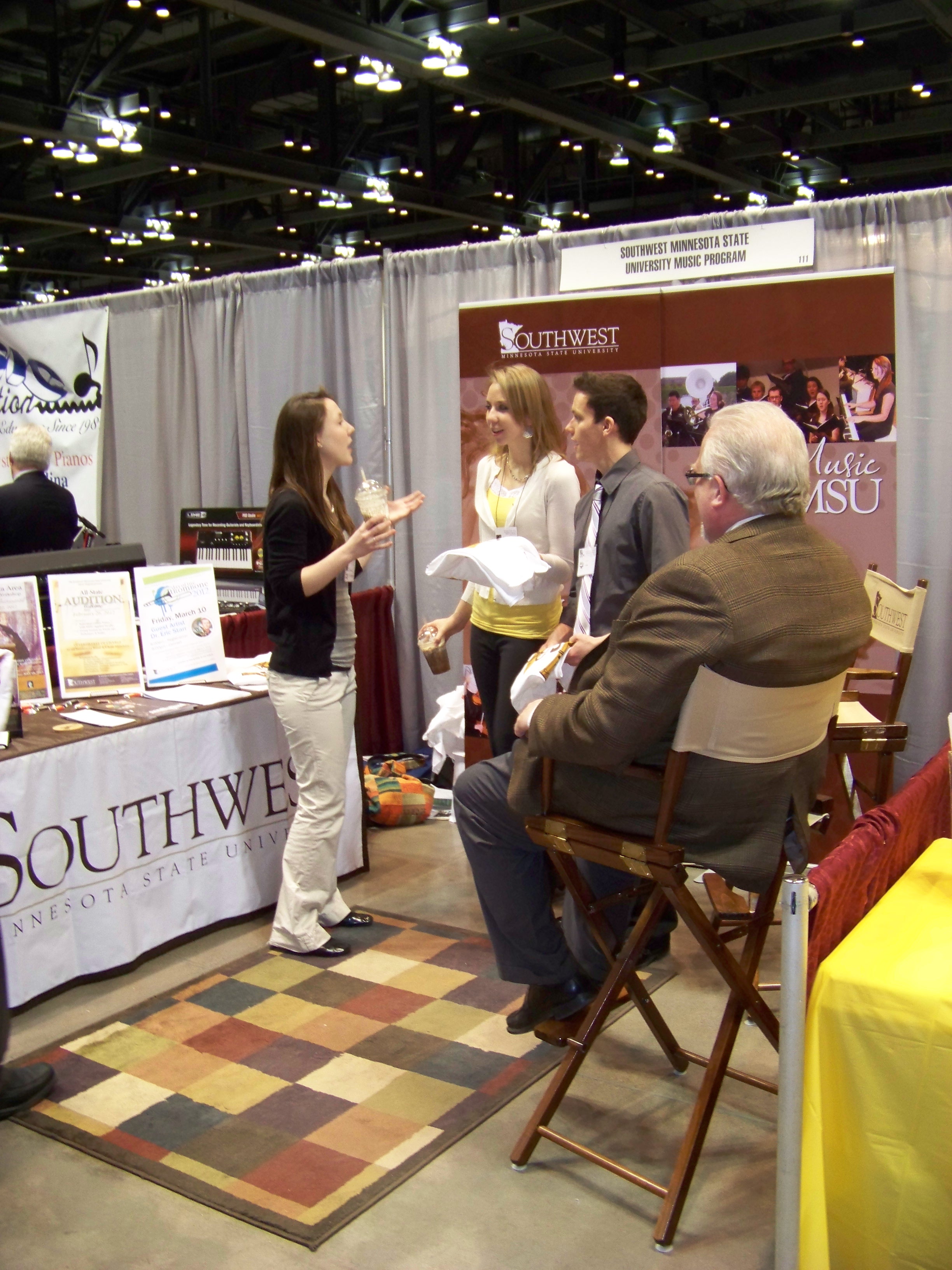 picture of students in the SMSU booth at the MMEA Midwinter Inservice
