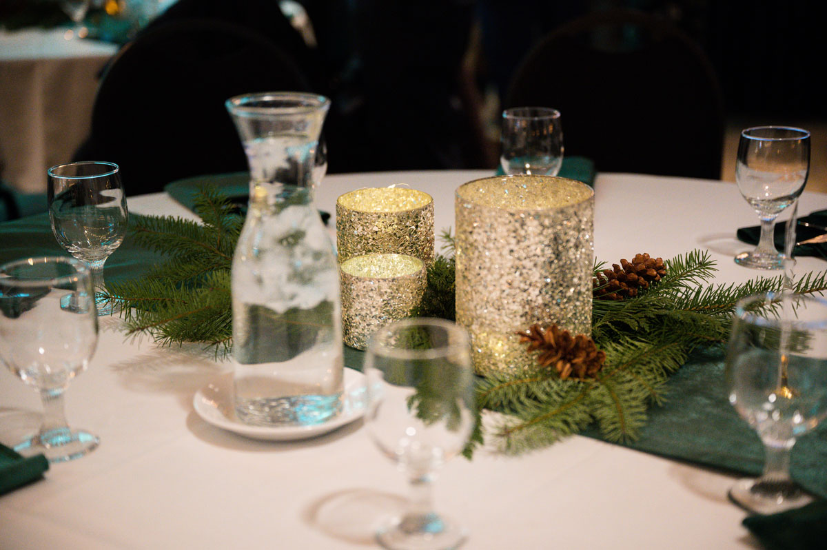 winter centerpiece with candles and pinecones