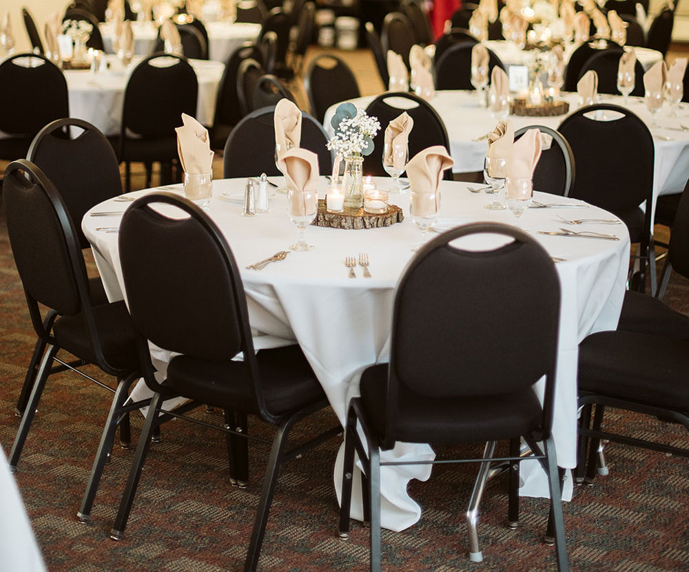 tables and chairs set up for wedding