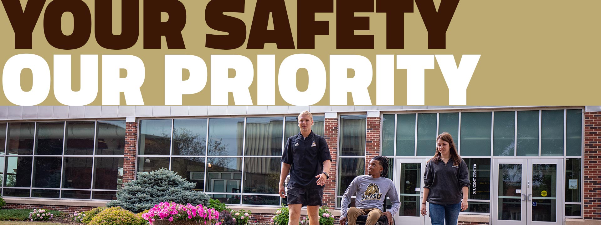 Students and Public Safety Officer in front of the Student Center