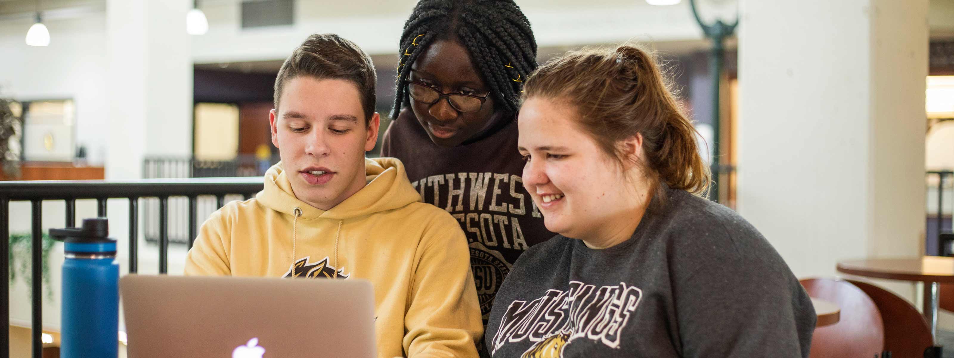 Students working on a laptop computer