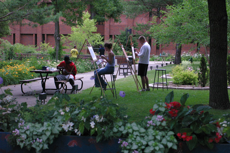 Students painting on campus