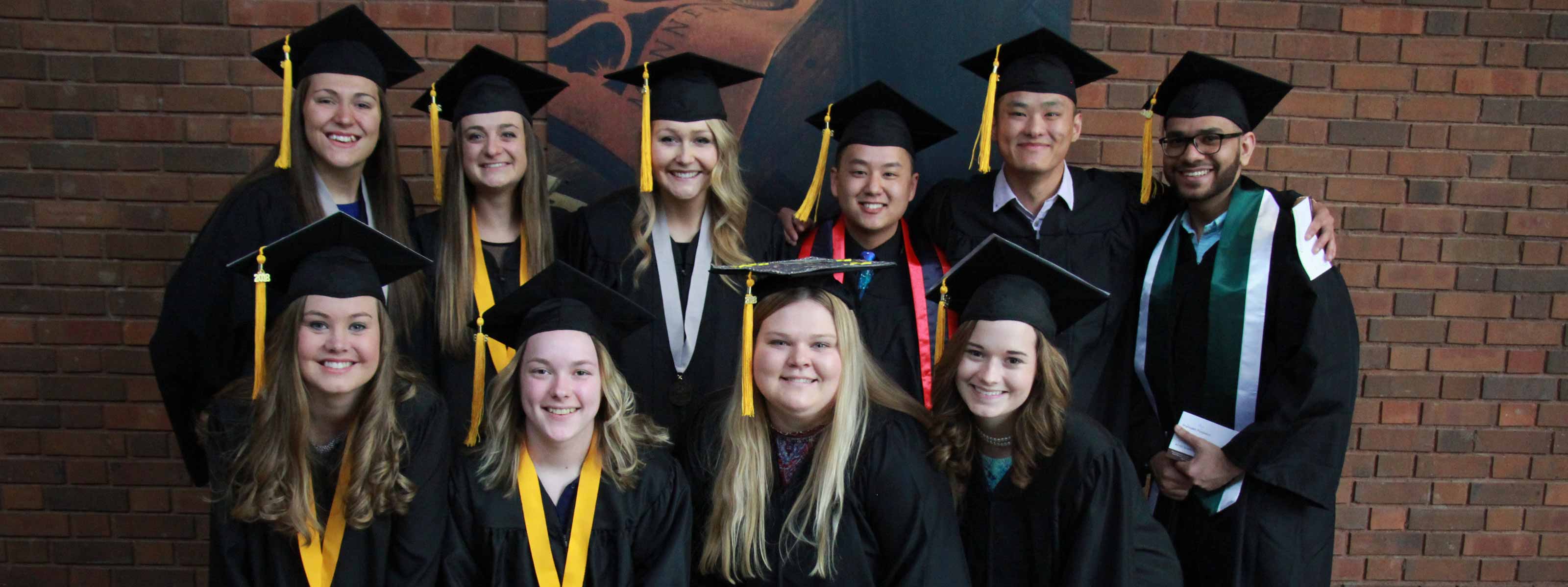 Students wearing commencement cap and gowns