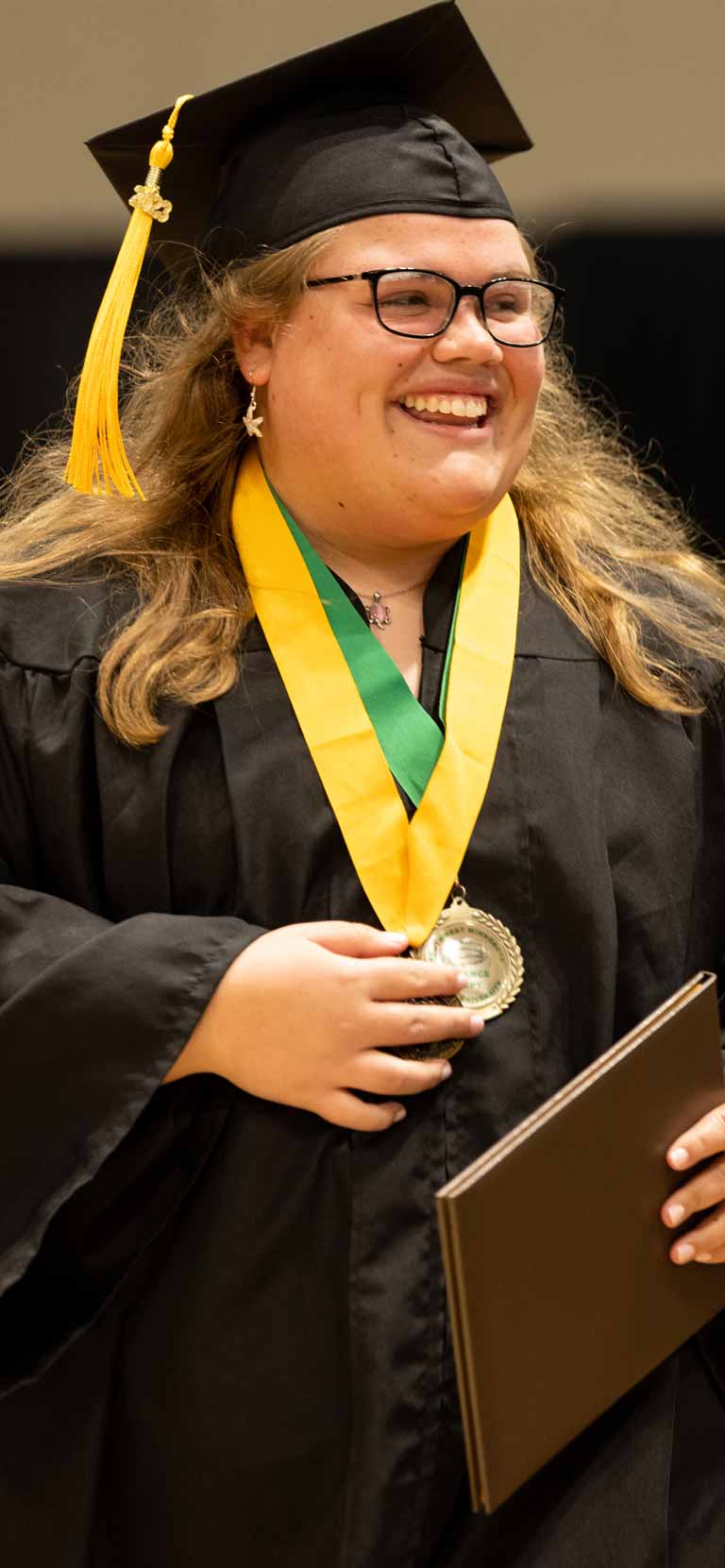 Photo of a student at Commencement