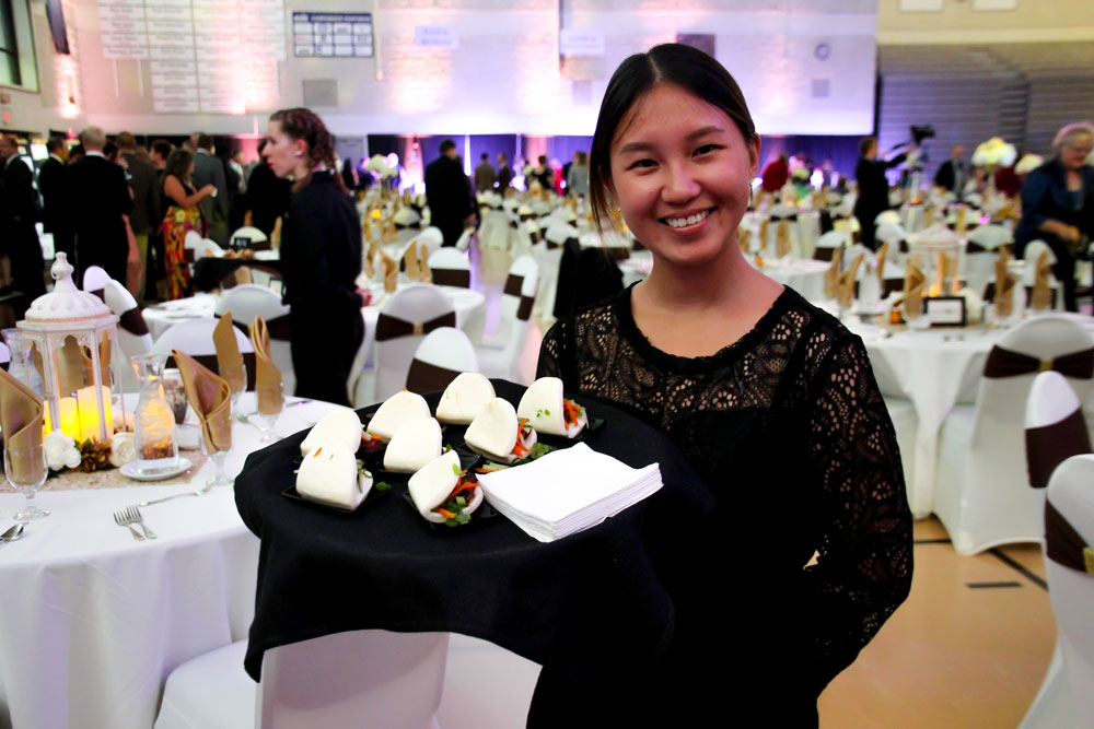 Student catering an event