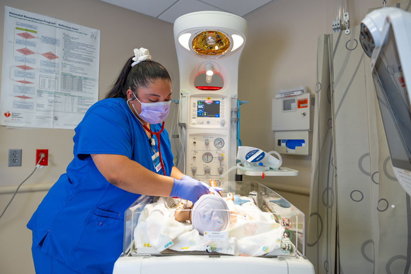 Nurse helping a newborn