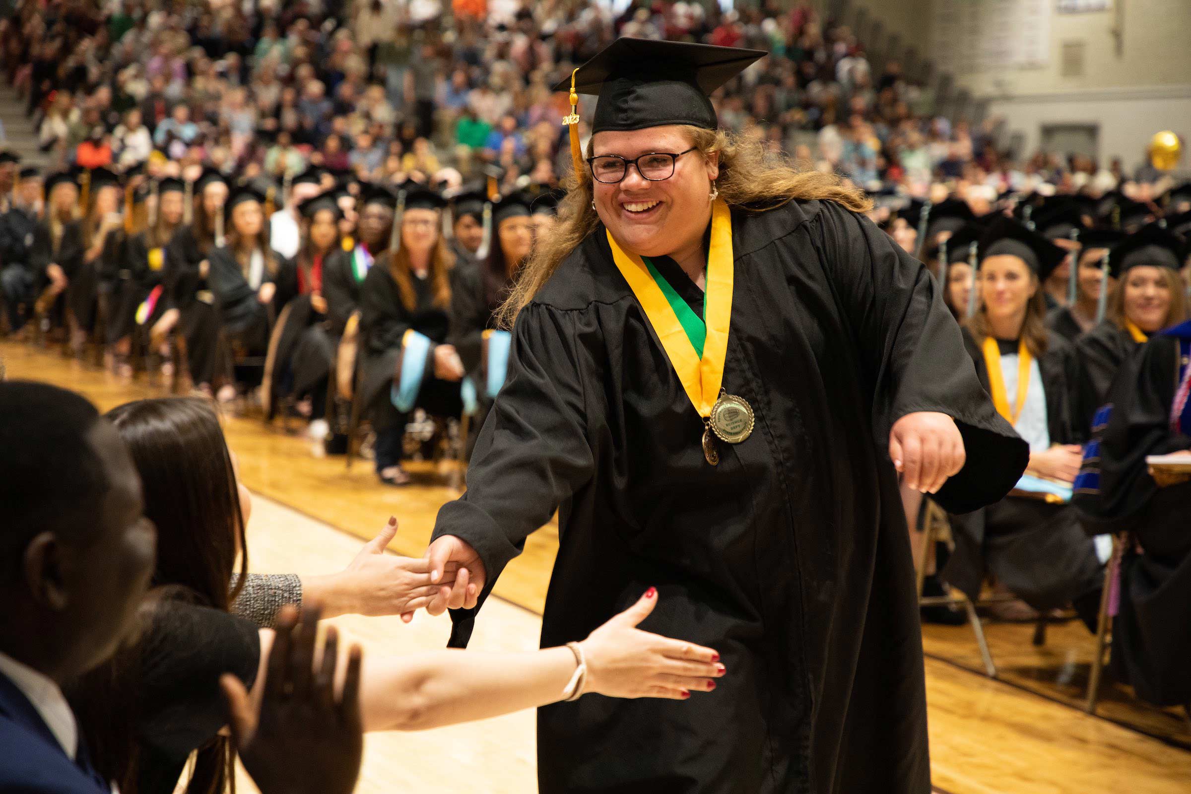 Katelynn Urness is congratulated as she goes to the platform to accept her award.