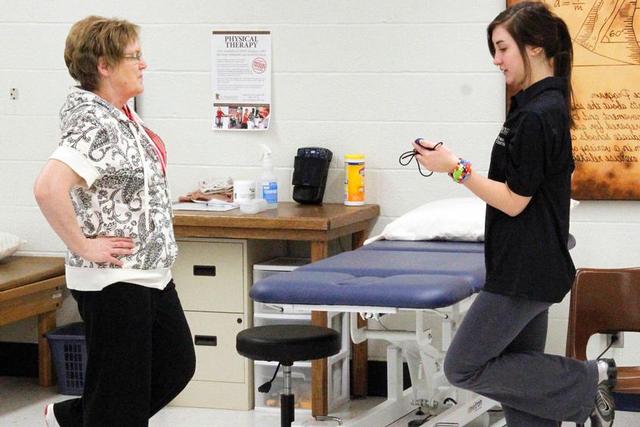 Student Britta Gibson, right, works with The Schwan Food Company employee Joan Woodford