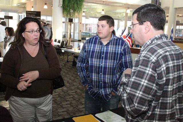 Dr. Jeff Kolnick speaks with potential students at a Mustang visit day.