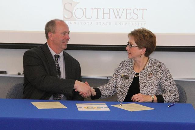 SMSU President Dr. Connie J. Gores, right, and Anoka-Ramsey President Kent Hanson