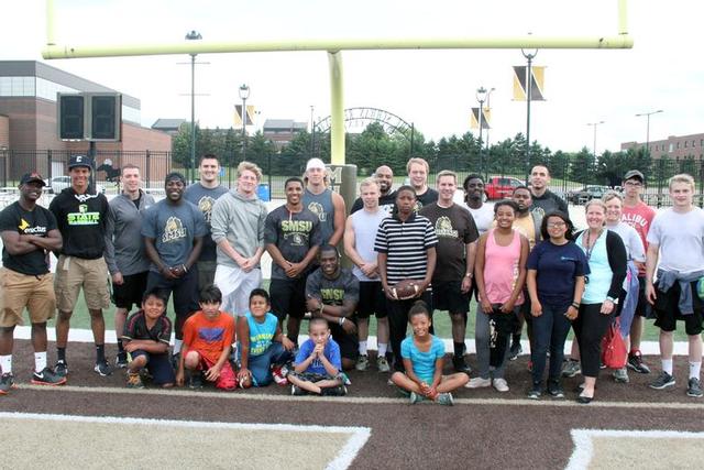 SMSU football players with Mustang Fans