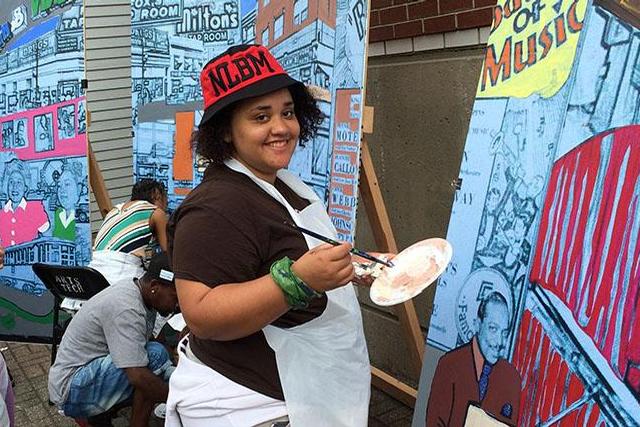 Sophia Pone, a Summer Bridge student, participated in "Spill Paint Not Blood" mural-painting