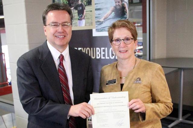 STI President Bob Griggs, left, and SMSU President Connie J. Gores