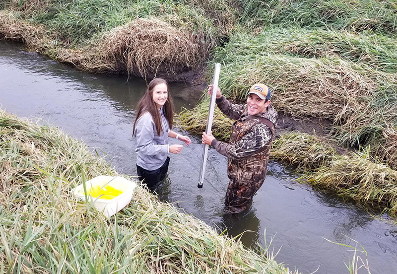 Brenna Kramer and Marco Gacke do research at Bluebird Creek